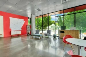 Modern office with large windows.